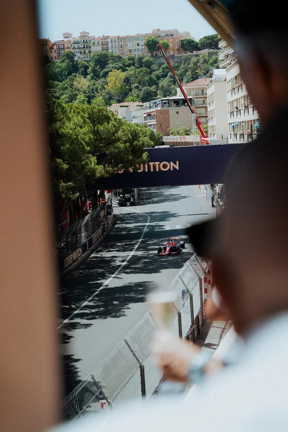 Formula 1 car on track seen from the Bronze Caravelle terrace, Louis Vuitton corner, during the Monaco Grand Prix